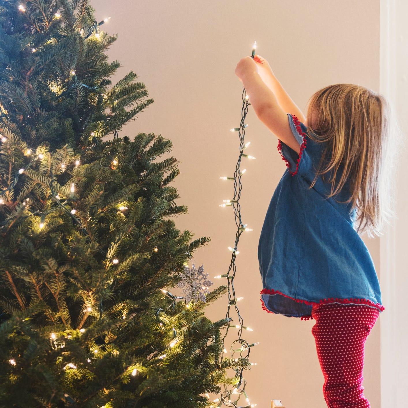 ben giusto recommends girl wrapped in christmas lights pic