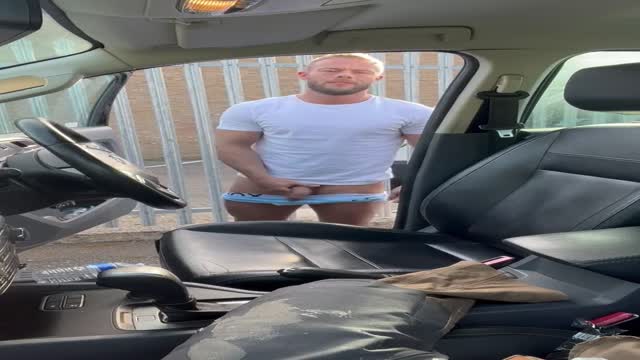 Men Driving Naked behind blocks