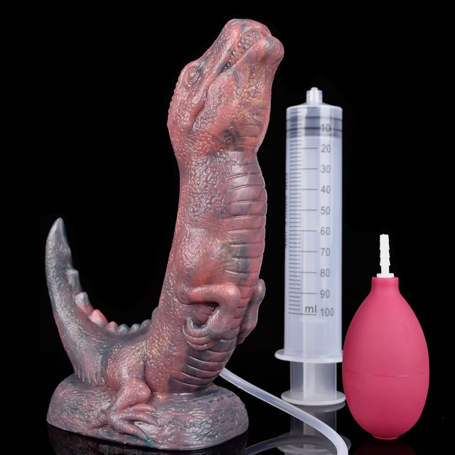 Bad Dragon Squirting Dildo a cage