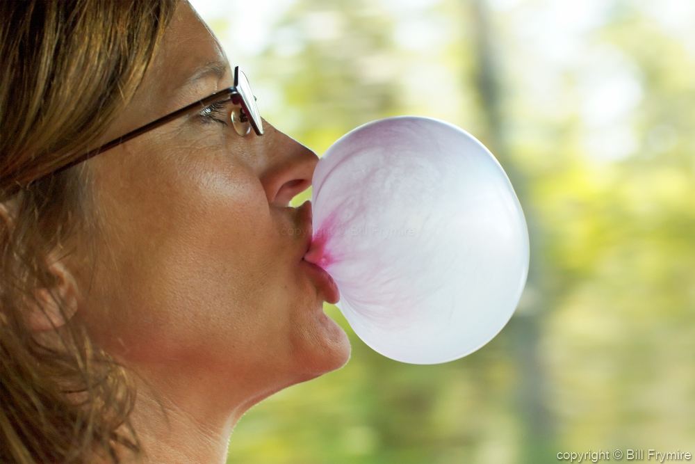 ardy lesmana share woman blowing bubble gum photos