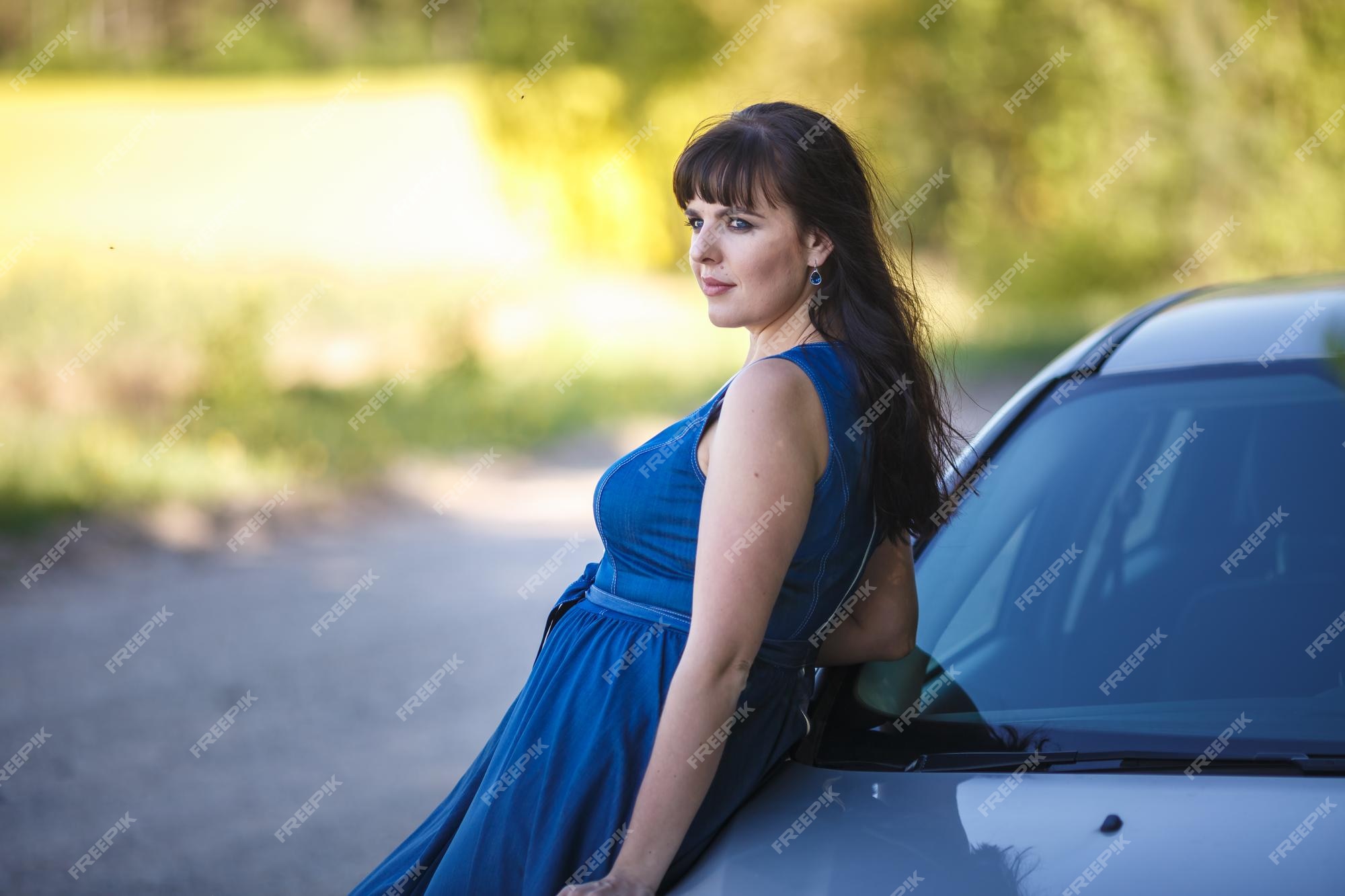 Best of Girl in blue dress in car