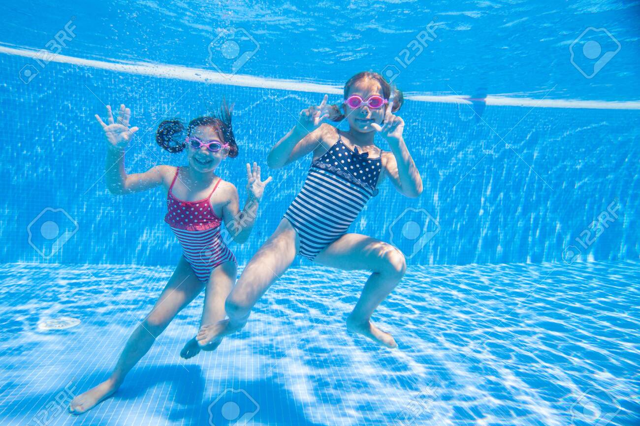 girls playing in pool