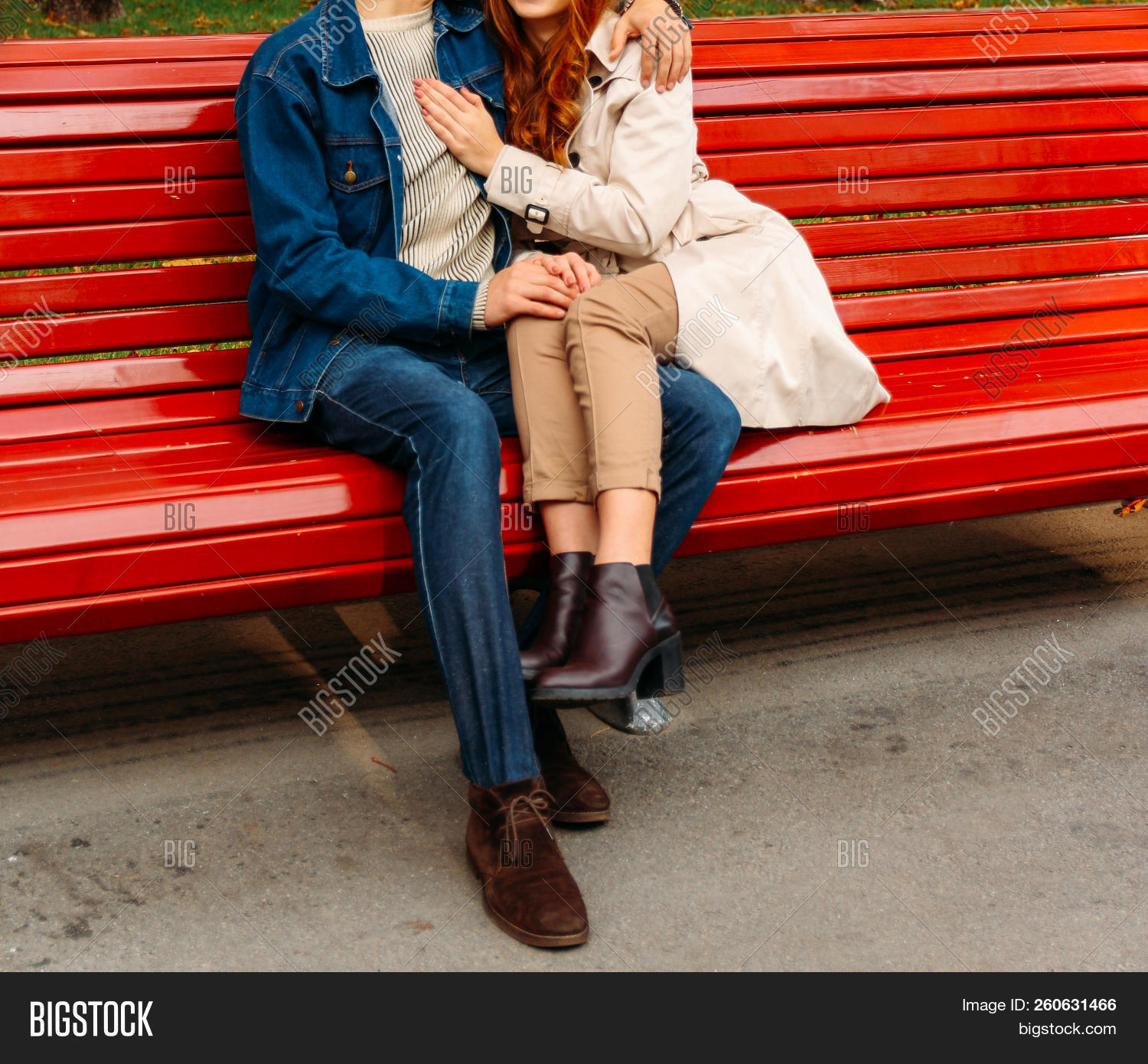 girl sitting on boy