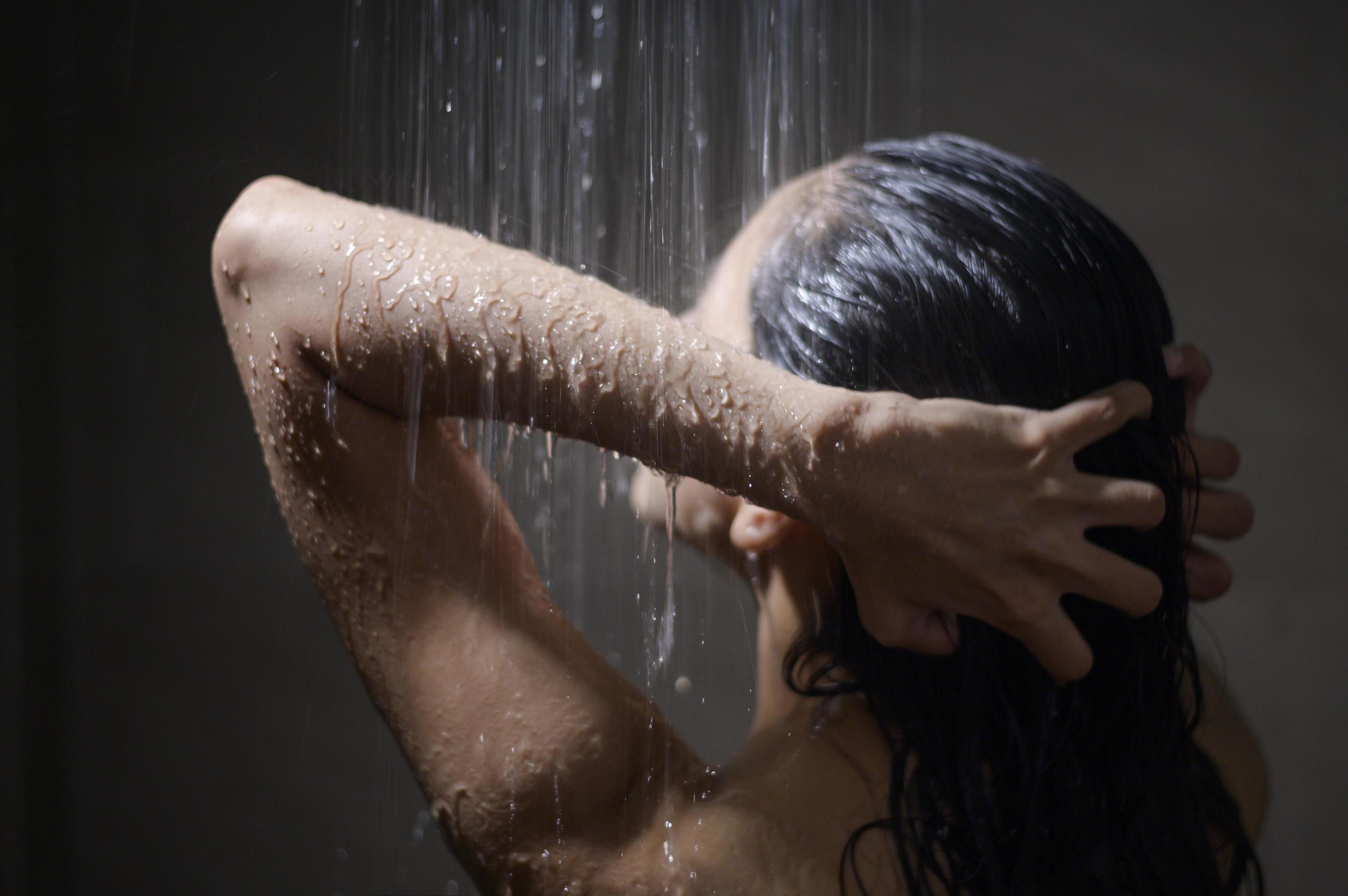 female taking a shower