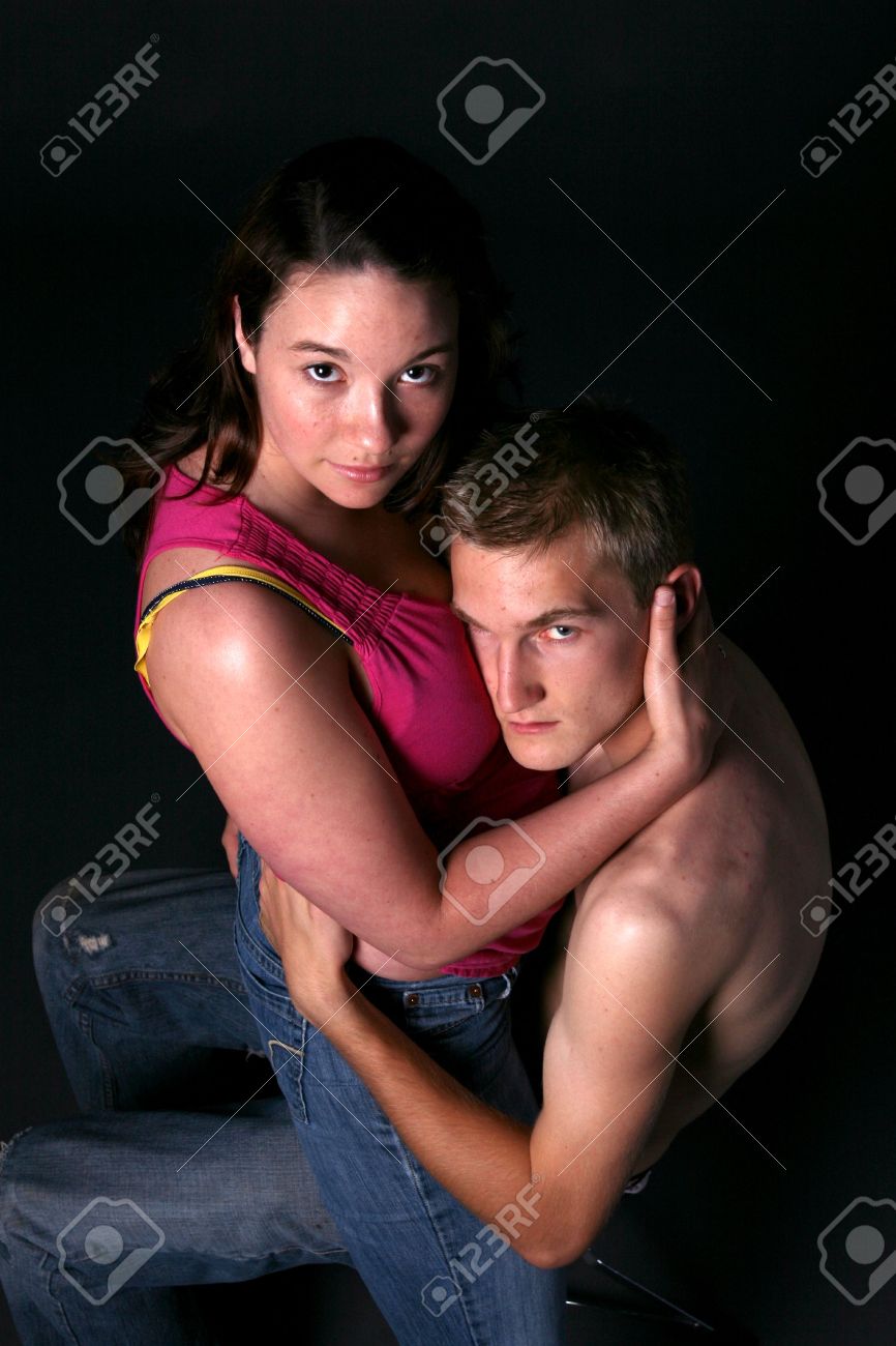 girl sitting on guy lap