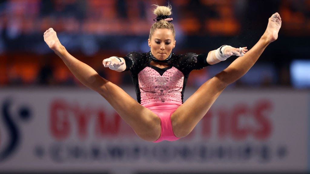 bonnie carlson add woman gymnast wardrobe malfunction photo