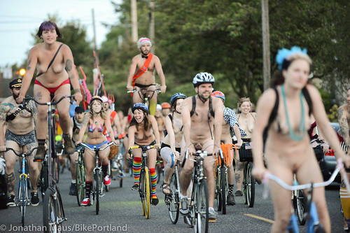 women riding bikes naked